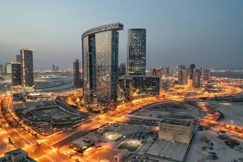 a city with a lot of tall buildings at night